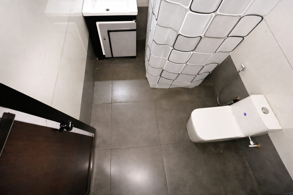 Bathroom in Layanila-homestay Alappuzha. dry western designed toilets and shower area.